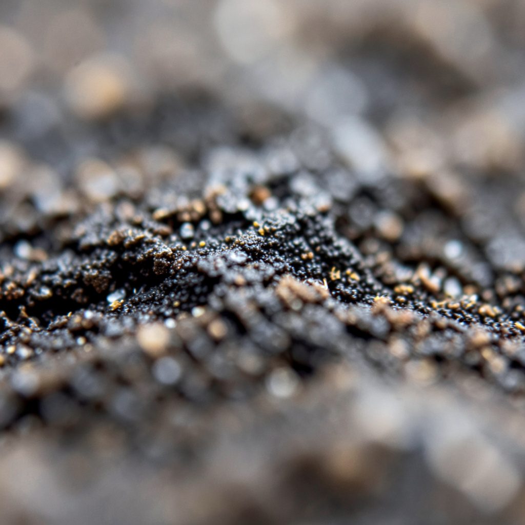 Extreme close-up of gold coin texture stacked closely, warm metallic tones